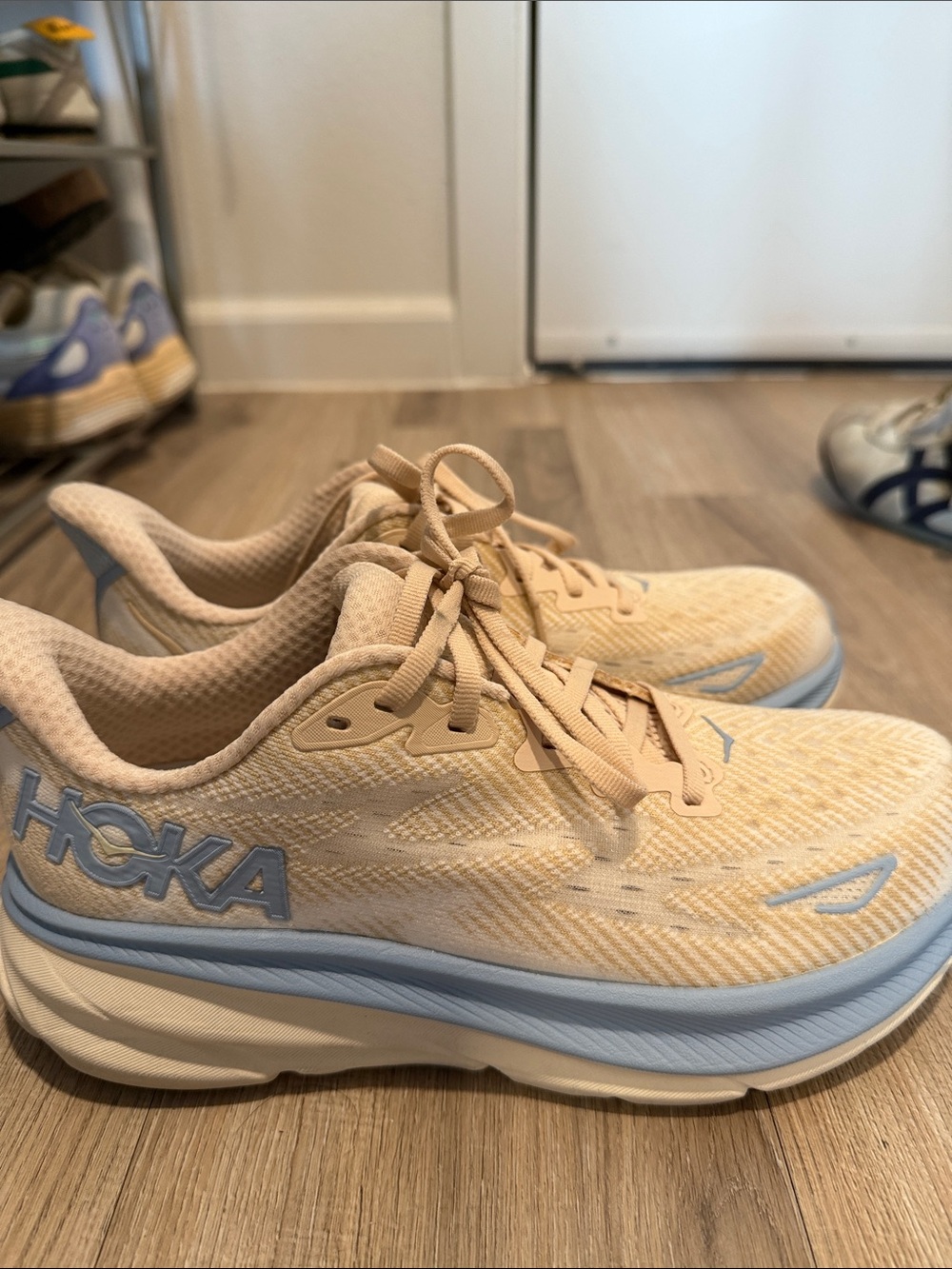 Hoka Women’s Clifton 9 Cream and Light Blue Athletic Running Shoes